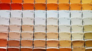 Huge selection of slightly varying paint colour swatches in cream to red hues