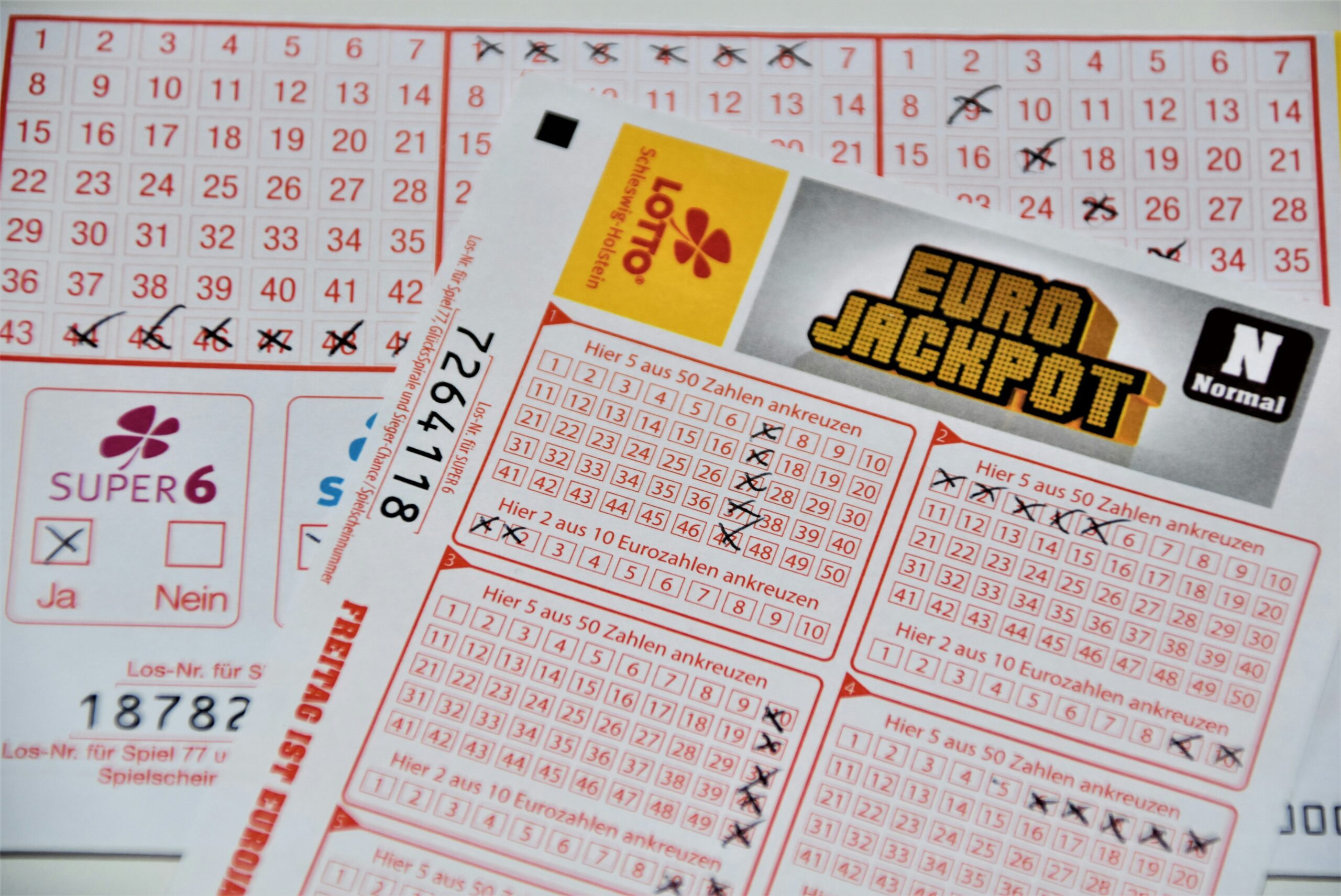 Filled out lottery ticket for Euro Jackpot on top of others